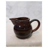 Brown ceramic creamer