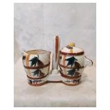 Hand painted ceramic cream and sugar in holder