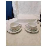 Pair of ceramic soup bowls with under plates