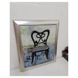 Framed oil painting of chair