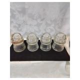 Group of four glass insulators