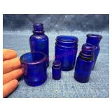 6 Smaller Blue Glass Bottles