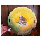 (LR)ï¿½Antique Monk 10in Plate w/ Yellow Rim