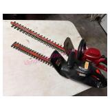 (G)ï¿½2 Electric Hedge Trimmers in Garage