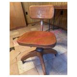 Antique Oak Swivel Desk Chair in basement