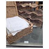 Basket of Linens and Wicker Wine Rack