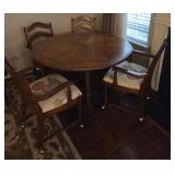 Round Dining Table with Four Arm Chairs on Casters