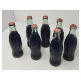 Seven Collectible Unopened Glass Coca-Cola Bottles
