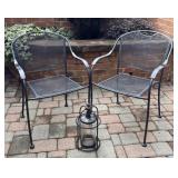 Two Metal Patio Chairs and One Lantern