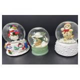 Three Snow Globes