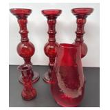 Four Red Glass Candle Holders with a Vase