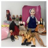 Assortment of Doll Heads, Parts, and Clothes