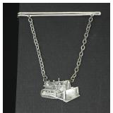 METAL ARTS CO. TIE PIN WITH CHARM