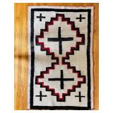 RED, WHITE AND BLACK MAT WITH NAVAJO-STYLE DESIGN
