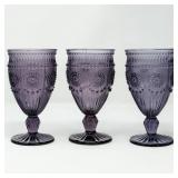THREE PURPLE PRESSED GLASS GOBLETS