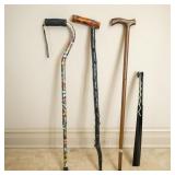 3 WALKING STICKS AND 1 LONG SHOEHORN