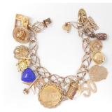 10KT GOLD CHARM BRACELET W/ 19 CHARMS $6,070