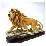 LION ON A LEDGE STATUE