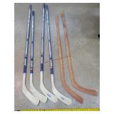 4- 56" to 61" CCM Hockey Sticks & 2 Wood Sticks