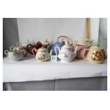 11 Tea Pots & 1 Sugar