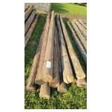 10- Treated Wooden Fence Posts 12 Ft. Long
