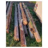 7- Treated Wooden Fence Posts 10-12 Ft. Long