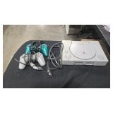 PLAYSTATION W/ CONTROLLERS AND PACMAN GAME