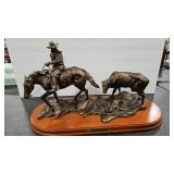 'TENDER LOVING CARE' RESIN SCULPTURE ON WOOD BASE