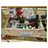 Bow with hand pruners sprinkler and wreath