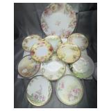 11 hand painted plates and saucers