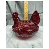 Ruby red hen on nest