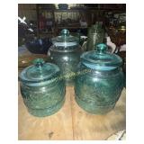 3 blue glass canisters