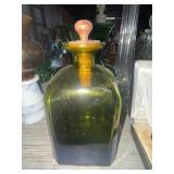 Green bottle with wooden stopper