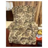 Wingback chair with floral upholstery