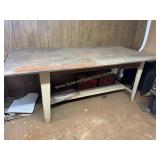 Metal base industrial work table   located in