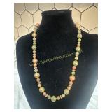 Artisan hand strung Green and rust polished stone