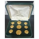 Waterbury button Co courvoisier cognac logo