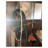 Group of hoses and weed eater