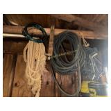 Ropes and hoses hanging in shop