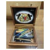 Vintage pens and pencils in cigar box