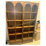Pair of MCM bookcases with storage drawers in