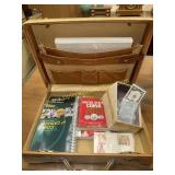 Coin books in briefcase