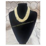 Multi strand faux pearl statement necklace