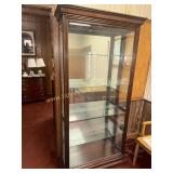 Lighted mahogany curio display cabinet