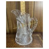 Heavy cut crystal pitcher has chip on mouth