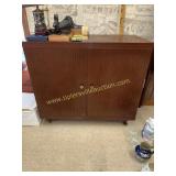 Vintage record cabinet veneer is loose in a