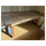 Pine primitive table located in basement must