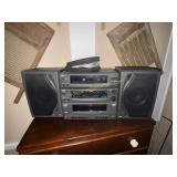 RCA stereo boombox and CDs