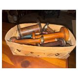 Basket of wooden spools