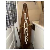 Laundry sign made from old wooden ironing board